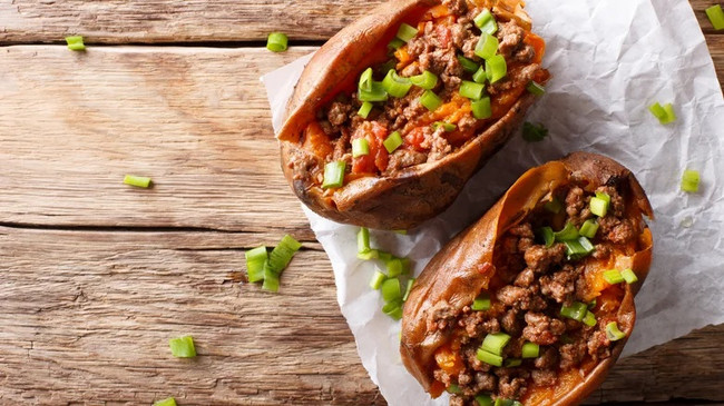 Take Your Baked Potato To The Next Level By Topping It With A Frozen Dinner